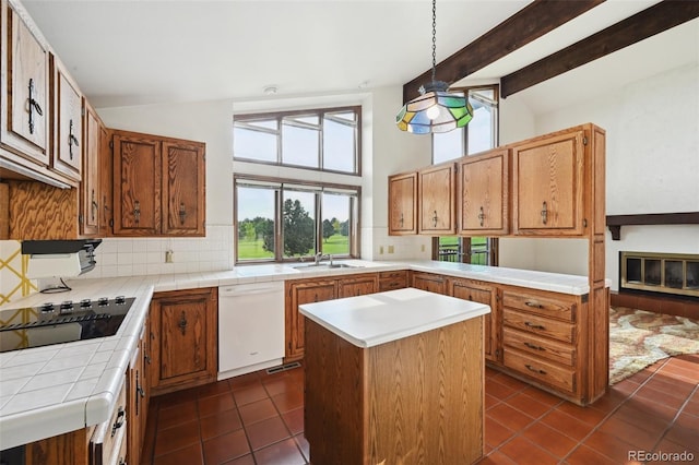 11621 Shoshone Way, Denver, CO 80234 - kitchen featuring white dishwasher, tile countertops, dark tile patterned flooring, black electric stovetop, and backsplash