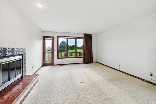 11621 Shoshone Way, Denver, CO 80234 - unfurnished living room featuring a tile fireplace, carpet, and recessed lighting