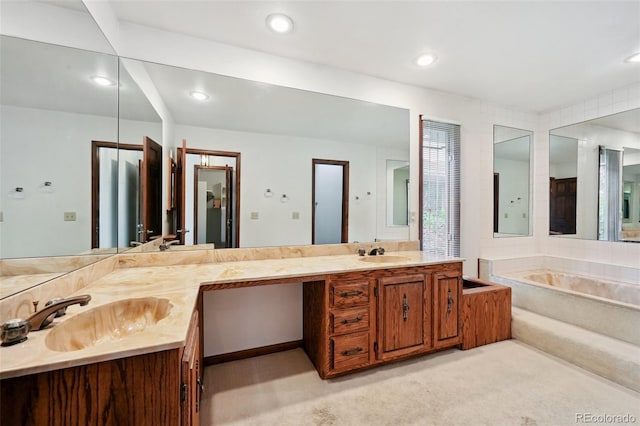 11621 Shoshone Way, Denver, CO 80234 - bathroom featuring double vanity, a bath, and recessed lighting