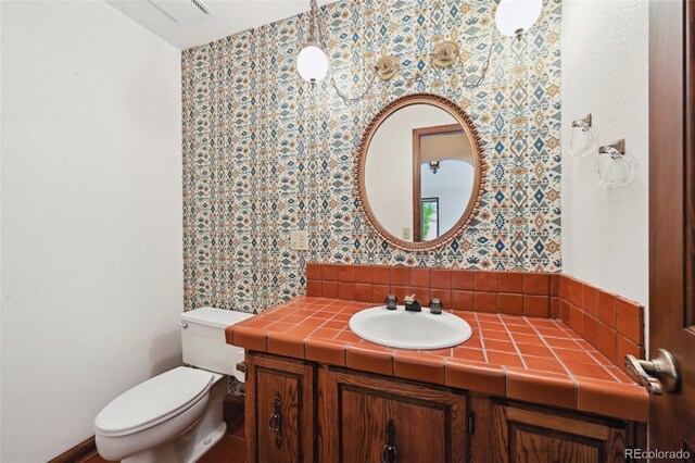 11621 Shoshone Way, Denver, CO 80234 - bathroom featuring vanity and wallpapered walls