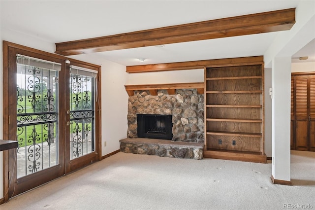 11621 Shoshone Way, Denver, CO 80234 - unfurnished living room featuring carpet floors, beamed ceiling, and a fireplace