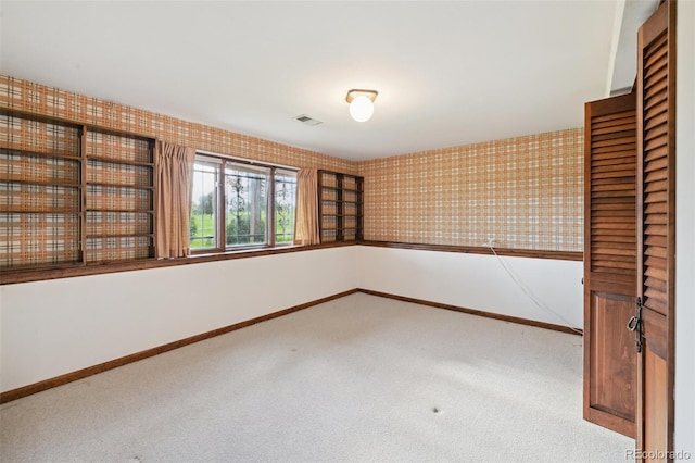 11621 Shoshone Way, Denver, CO 80234 - unfurnished room with carpet floors and wallpapered walls