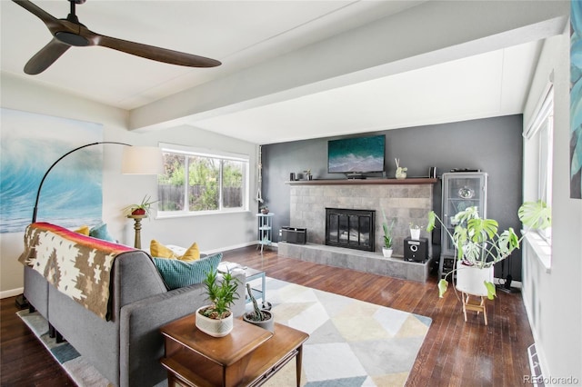 6188 S Westview St, Littleton, CO 80120 - living area with a glass covered fireplace, baseboards, beam ceiling, and wood finished floors