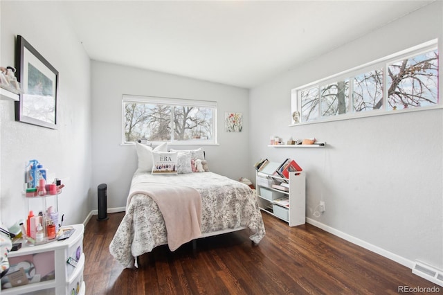 6188 S Westview St, Littleton, CO 80120 - bedroom with baseboards, visible vents, and wood finished floors