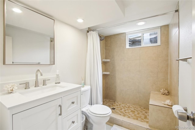 6188 S Westview St, Littleton, CO 80120 - full bath with vanity, recessed lighting, a tile shower, and toilet