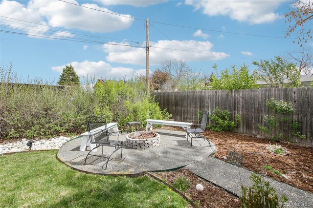 6188 S Westview St, Littleton, CO 80120 - view of patio with a fenced backyard and a fire pit