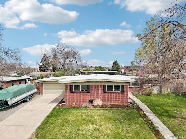 6188 S Westview St, Littleton, CO 80120 - view of front of house with brick siding, a garage, a front lawn, and driveway
