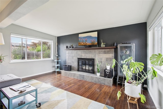 6188 S Westview St, Littleton, CO 80120 - living room with baseboards, a glass covered fireplace, wood finished floors, and a wealth of natural light