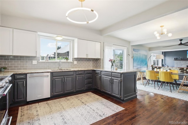 6188 S Westview St, Littleton, CO 80120 - kitchen featuring white cabinets, light stone counters, a sink, dark wood finished floors, and stainless steel appliances