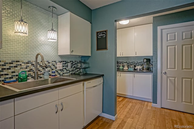 kitchen with white cabinets, hanging light fixtures, dishwasher, backsplash, and sink