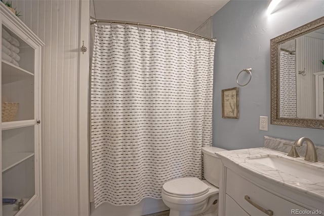 bathroom with vanity, toilet, and a shower with curtain