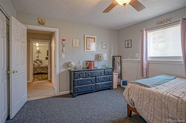 carpeted bedroom with ceiling fan