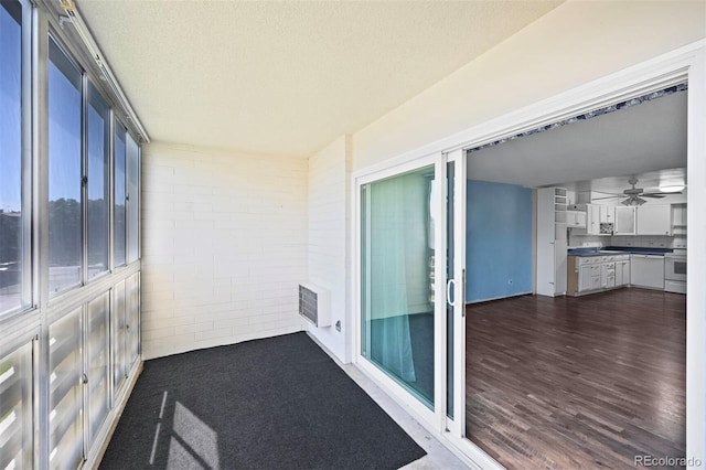 350 S Clinton St Unit 8C, Denver, CO 80247 - unfurnished sunroom with heating unit