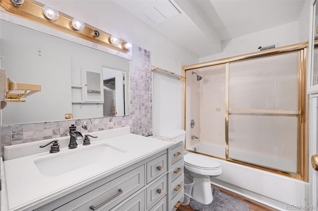 350 S Clinton St Unit 8C, Denver, CO 80247 - bathroom featuring vanity, enclosed tub / shower combo, backsplash, and wood finished floors