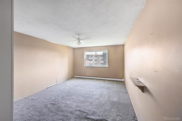 350 S Clinton St Unit 8C, Denver, CO 80247 - spare room with a baseboard heating unit, ceiling fan, carpet flooring, and a textured ceiling