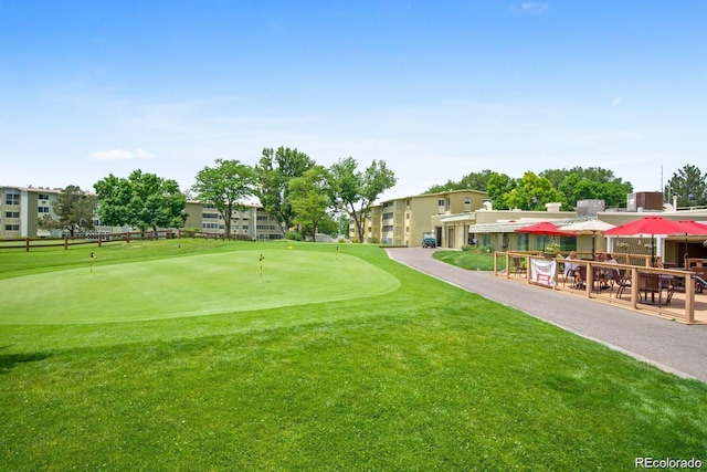 350 S Clinton St Unit 8C, Denver, CO 80247 - view of property's community with an area to practice putting, golf course view, and a lawn