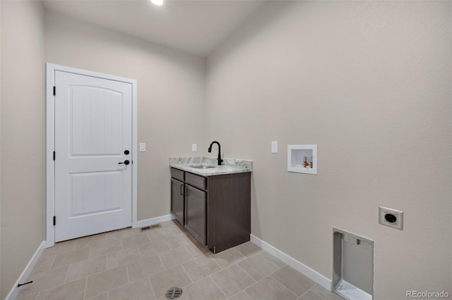 16990 Early Light Dr, Colorado Springs, CO 80908 - laundry room featuring washer hookup, a sink, baseboards, hookup for an electric dryer, and visible vents