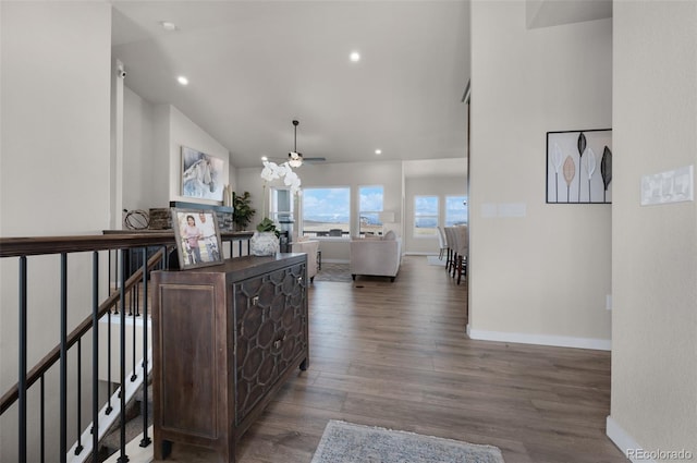 16990 Early Light Dr, Colorado Springs, CO 80908 - hall featuring recessed lighting, baseboards, high vaulted ceiling, and wood finished floors