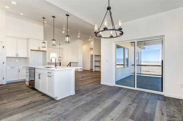 16990 Early Light Dr, Colorado Springs, CO 80908 - kitchen featuring dark wood-style floors, recessed lighting, a chandelier, a sink, and dishwasher