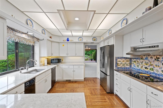 2800 S University Blvd Unit 1, Denver, CO 80210 - kitchen featuring stainless steel appliances, under cabinet range hood, white cabinets, and plenty of natural light