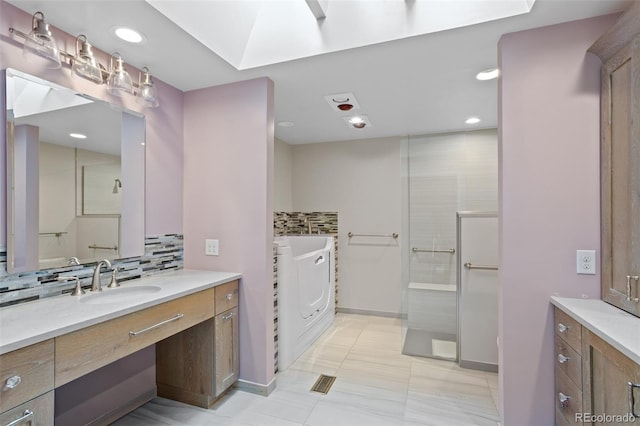 2800 S University Blvd Unit 1, Denver, CO 80210 - full bathroom with vanity, tasteful backsplash, washer / dryer, recessed lighting, and walk in shower