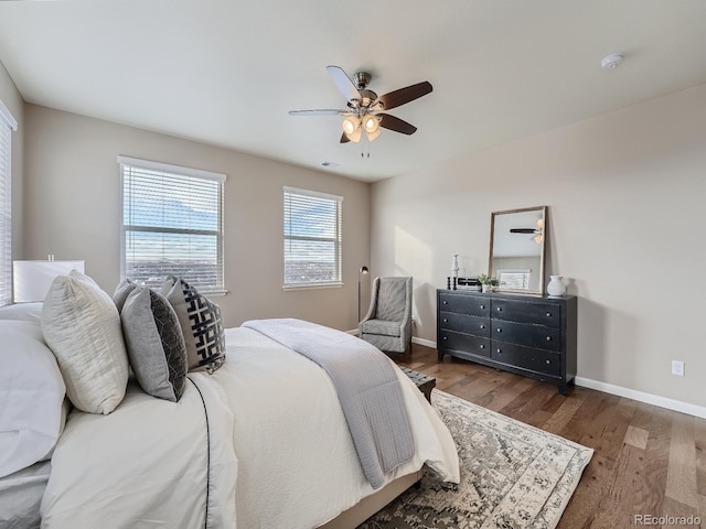 bedroom featuring dark hardwood / wood-style floors and ceiling fan
