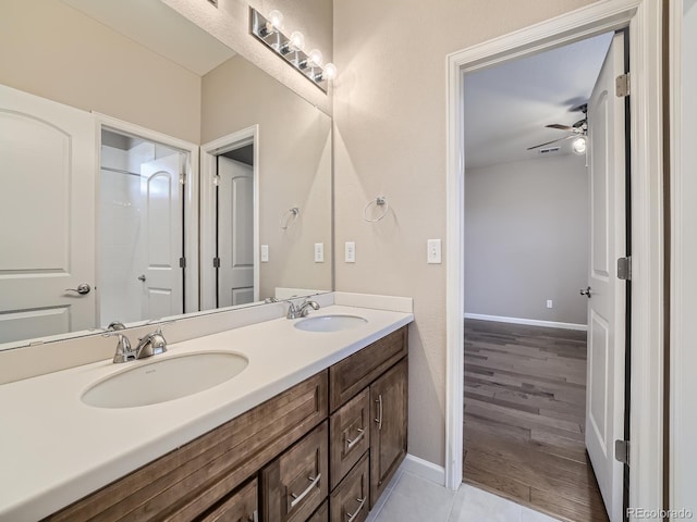 bathroom featuring ceiling fan, vanity, and tile patterned floors