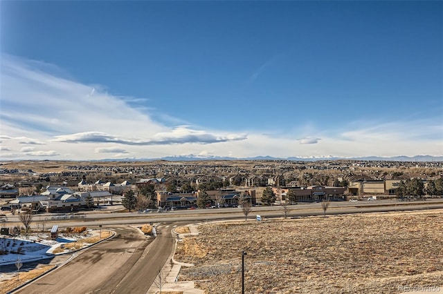 birds eye view of property with a mountain view