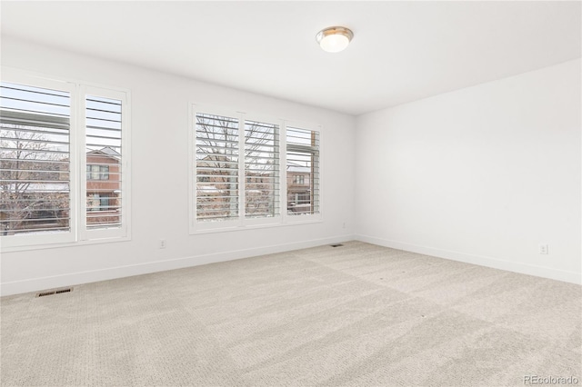 empty room with light colored carpet