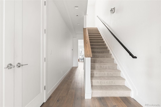 stairway with wood-type flooring