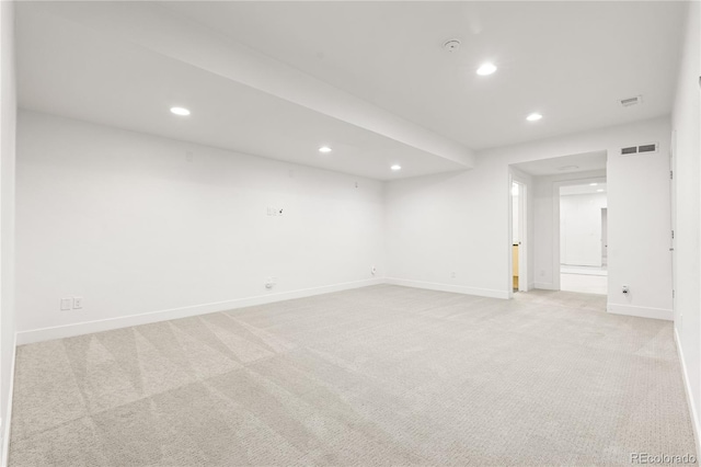 unfurnished room with light carpet