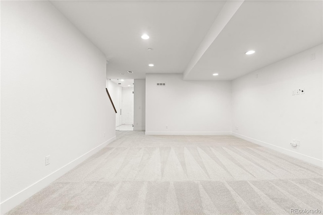 spare room with light carpet