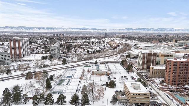 snowy aerial view featuring a mountain view