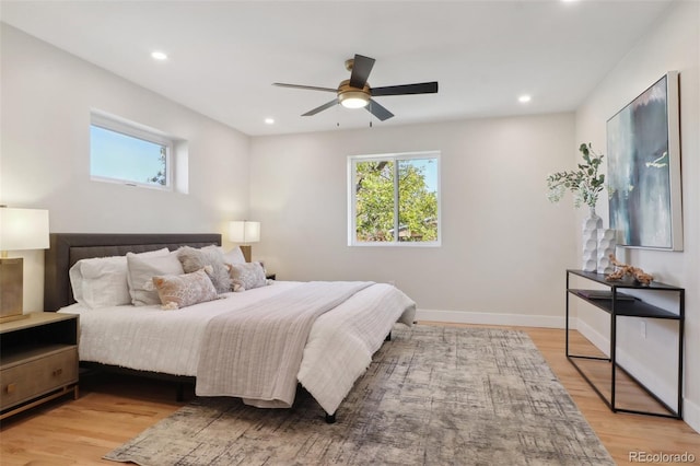 bedroom featuring ceiling fan and light hardwood / wood-style floors