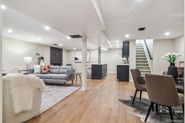 living room with light hardwood / wood-style floors