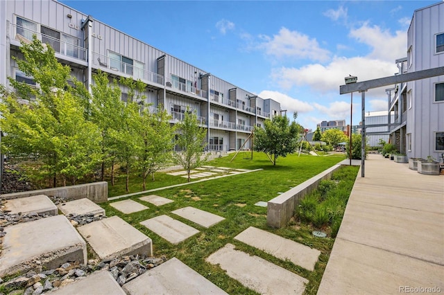 view of home's community featuring a lawn