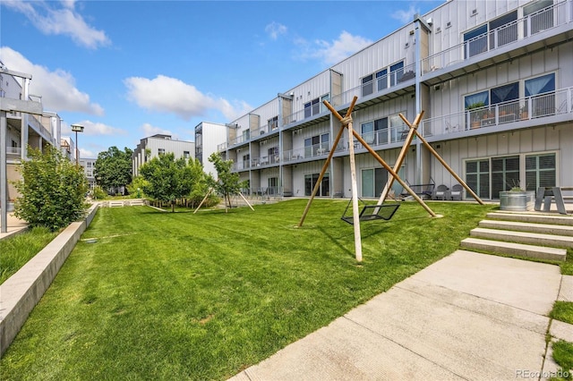 view of community featuring a lawn