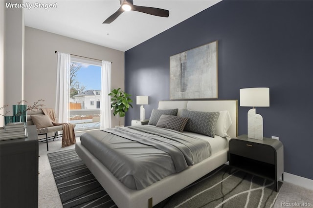 carpeted bedroom featuring ceiling fan