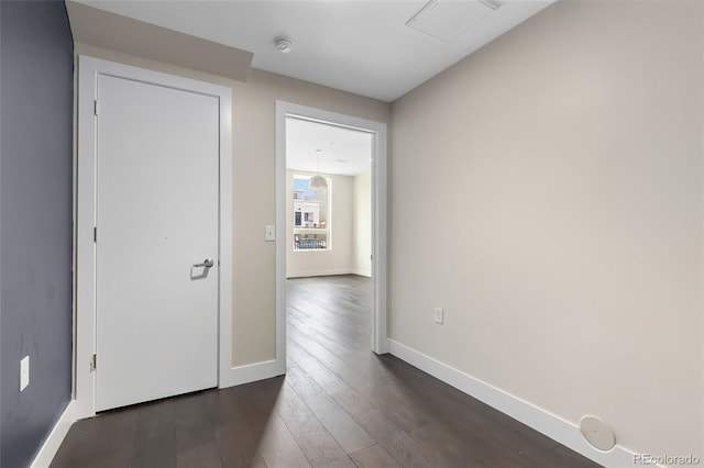 hallway featuring dark hardwood / wood-style flooring