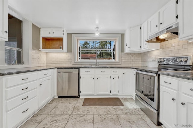 kitchen featuring white cabinets, decorative backsplash, stainless steel appliances, and sink