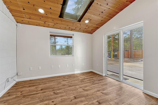 unfurnished room featuring wood-type flooring, wooden ceiling, and vaulted ceiling