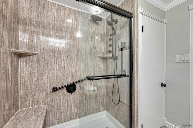 bathroom featuring crown molding and walk in shower