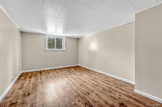 spare room featuring light hardwood / wood-style floors