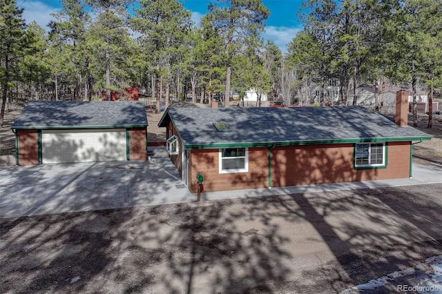 view of front of home with an outbuilding and a garage