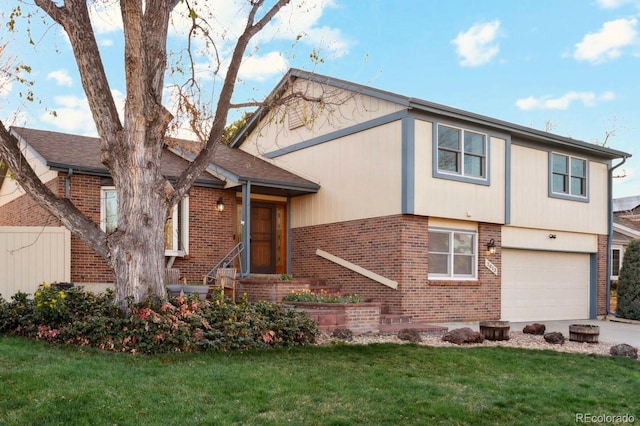 2013 S Holland St, Lakewood, CO 80227 - view of front of home featuring a garage, a front lawn, brick siding, and driveway
