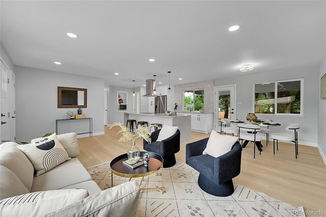 6526 S Elmwood St, Littleton, CO 80120 - living room with light wood-style flooring, baseboards, and recessed lighting