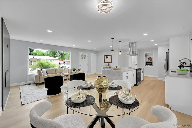 6526 S Elmwood St, Littleton, CO 80120 - dining area with light wood-style floors, baseboards, and recessed lighting
