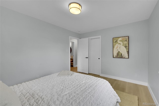 6526 S Elmwood St, Littleton, CO 80120 - bedroom featuring wood finished floors, baseboards, and a closet