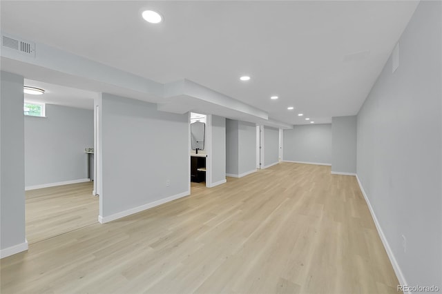 6526 S Elmwood St, Littleton, CO 80120 - basement with light wood-style flooring, baseboards, and recessed lighting