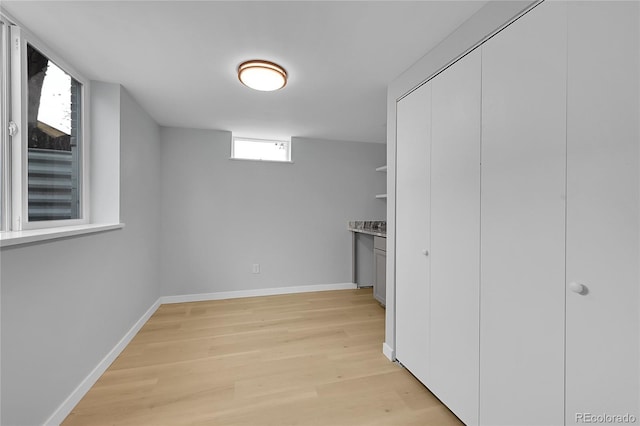6526 S Elmwood St, Littleton, CO 80120 - below grade area with light wood-style flooring and baseboards